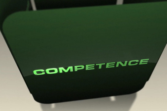 Wort "comeptence" auf einer grünen kachel